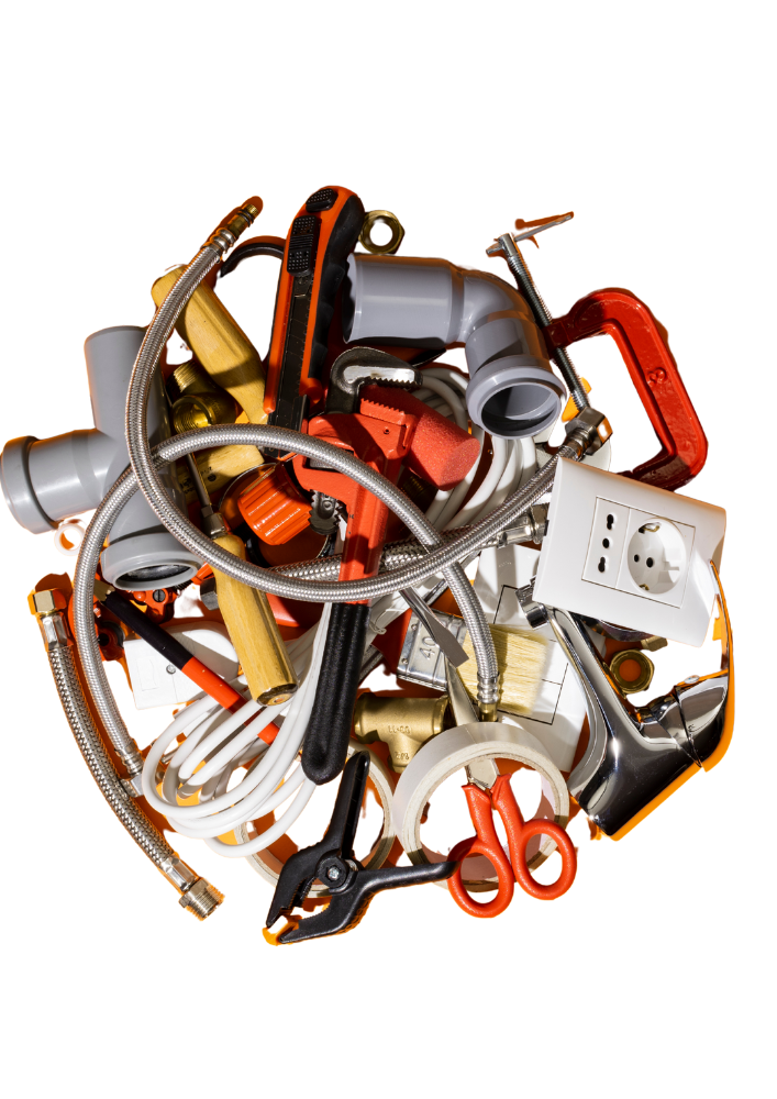 Assorted DIY electrical tools and parts scattered on a wooden surface, representing the risks of unlicensed electrical work.